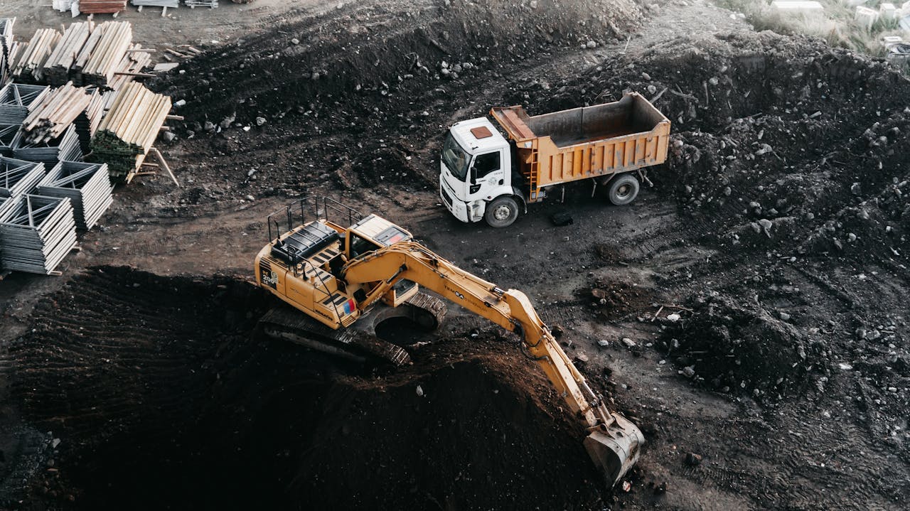 Dump truck and excavator at an industrial construction site in Istanbul, Turkey.