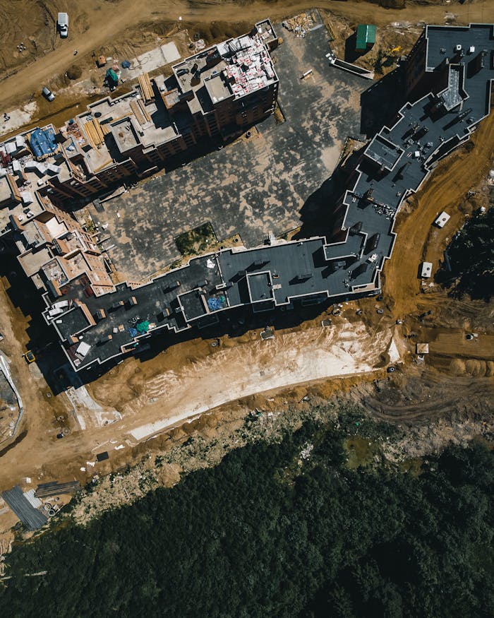 High-angle view of a large building under construction, showcasing modern architecture.